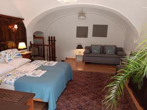 a living room with a bed and a couch at Scheibbsbachhof in Scheibbsbach