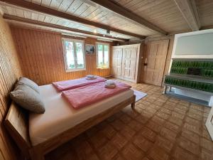 a bedroom with a large bed in a room at Chalet Montes in Lauterbrunnen