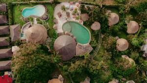 an overhead view of a resort with a swimming pool at La Joya Balangan Resort in Jimbaran