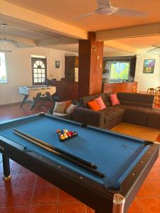 a living room with a pool table in it at Villa Dijoux D'O in Entre-Deux
