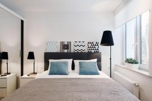 Postel nebo postele na pokoji v ubytování Apartamenty MISTRAL