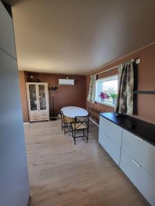 a kitchen and dining room with a table and chairs at Local home apartment in Stavanger in Stavanger