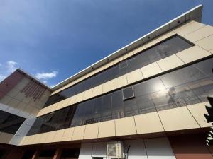 a large building with a lot of windows at Hotel Green Land in Mathura
