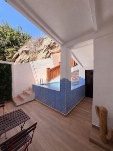 a house with a swimming pool and a patio at Enamórate con vistas al mar en La Marina House in La Alcazaba