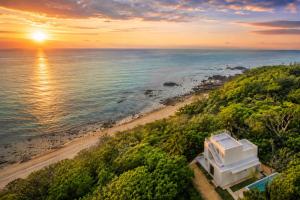 an aerial view of a beach at sunset at The Seven Stars Resort in Ishigaki Island