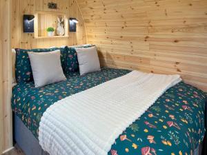 a bedroom with a bed in a wooden room at Birch - Uk51862 in Reighton