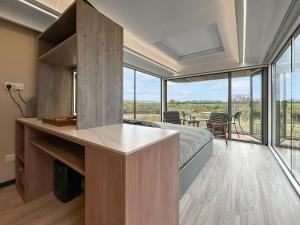 a bedroom with a bed and a large window at Vessel 1 - Ukc9441 in Glasgow