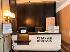 a counter in a restaurant with signs on it at Prime Hotel Beijing Wangfujing in Beijing +85 photos