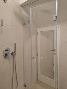 a shower with a glass door in a bathroom at Pinturicchio Luxury Suite in Perugia +37 photos