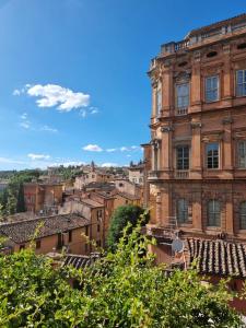 a view of the city from the roof of a building at Pinturicchio Luxury Suite in Perugia