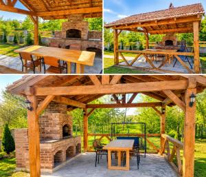 a wooden pavilion with a picnic table and an outdoor oven at Villa MATE & Villa LUKA in Ureki
