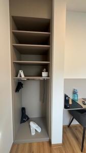 a closet with empty shelves in a room at Hotel Falken in Hechingen