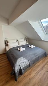 a bedroom with a large bed in a attic at Hotel Falken in Hechingen +41 photos
