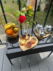 a tray of food on a table with fruit at Nia&Mari in Telavi +12 photos