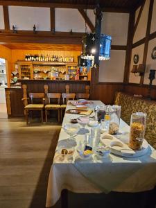 a table with food on it in a restaurant at Moocks Hotel in Altenau