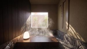 a room with a window and a light on the floor at Ruhe K in Kusatsu