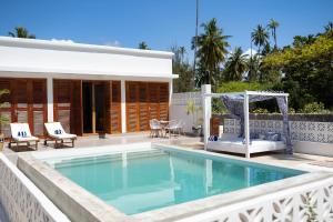 a villa with a pool and a gazebo at ZAN Orient Bwejuu Hotel in Makunduchi +124 photos