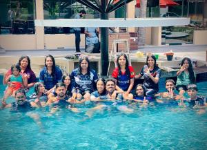 a group of people in the swimming pool at Infenta's Villa Hotel & restaurant in Pandattarippu