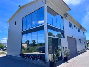 an office building with large glass windows at Oxygen Rooms in Hunedoara
