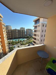 a balcony with a view of a city at Alfas Beach Apartments in Shëngjin