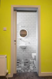 a bathroom with a sink and a toilet at The Camden Street Hotel in Dublin +21 photos