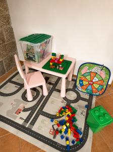 a table and chair with a toy train on a track at Pod Maliníkem in Bedřichov