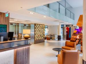 a lobby of a hotel with a waiting room at ibis Styles Tallinn in Tallinn