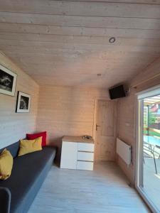 a living room with a couch and a table at Zacisze in Józefów