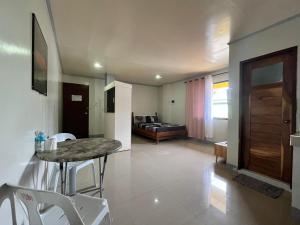 a living room with a table and a couch at ZM Residence in Dapa +59 photos