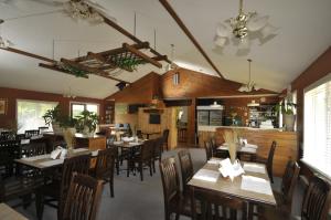 a dining room with wooden tables and chairs at Spring Lake Resort in Dwight