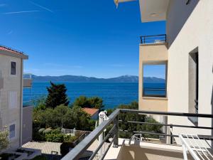a view of the ocean from the balcony of a house at Zen Residence in Brist