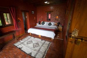 Letto o letti in una camera di Shivapuri Heights Cottage