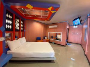 a bedroom with a large bed in a lego room at My House in Surin +5 photos