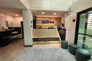 a room with a bed with a sign on it at Ecoland 88 Apartelle and Suite near SM Davao in Davao City
