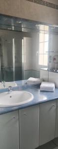 a bathroom with a sink and a mirror at La Genetouze in La Genétouze +9 photos