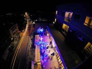 an overhead view of a street at night with christmas lights at Hotel Estrella in Tacloban