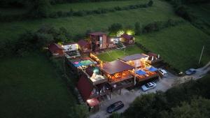 an aerial view of a large house with a yard at Bosnian Pyramid Glamping in Visoko +143 photos
