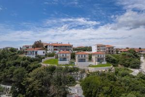 an aerial view of a house on a hill at Grande Blu by NG Villas in Afitos