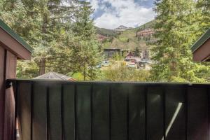 a fence with a view of a mountain at Manitou Lodge 11 by Alpine Lodging Telluride in Telluride