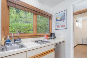 a kitchen with a sink and a window at Manitou Lodge 4 by Alpine Lodging Telluride in Telluride