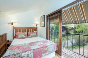 a bedroom with a bed and a balcony at Manitou Lodge 6 by Alpine Lodging Telluride in Telluride