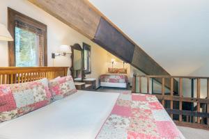a bedroom with a bed and a staircase at Manitou Lodge 7 by Alpine Lodging Telluride in Telluride