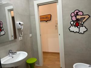 a bathroom with a sink and a mirror at Corsica Rooms in Termoli