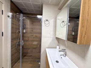 a bathroom with a sink and a shower at Dalaman Airport Suite 11 in Dalaman