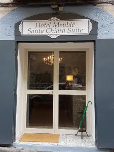 a door to a hotel malibu santa chiara suite at Hotel Meublè Santa Chiara Suite in Naples