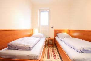 Кровать или кровати в номере Ferienwohnung 449 im Haus Knechtsand