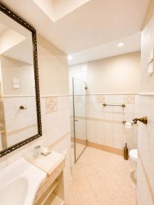 a bathroom with a shower and a sink and a mirror at Apartment Sulle scale in Piran +4 photos