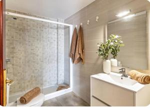 a bathroom with a shower and a toilet and a sink at Barlovento Apartment 2 in Playa Honda