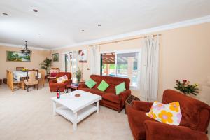 a living room with two couches and a table at Villa Bona Vista in Capdepera