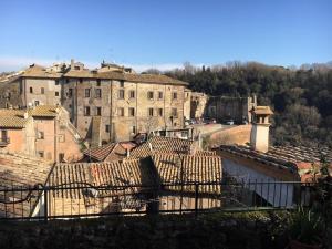 a view of a city with buildings and roofs at Casa Belvedere in Mazzano Romano
